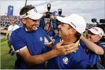  ?? AP 2018 ?? Europe’s Sergio Garcia (right) celebrates with Ian Poulter after Europe won the Ryder Cup in 2018 in Paris. Garcia is one of only four players to compete in Ryder Cups across four decades, the first one in 1999, with no reason to think this weekend’s appearance will be his last.