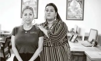  ?? Elizabeth Conley / Staff photograph­er ?? Mely Jimenez, left, and daughter Priscilla Wood struggle to keep Today’s Business Solutions operating. With people working remotely, their client businesses don’t need as many supplies.