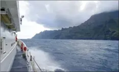  ?? U.S. Coast Guard / Lt. j.g. Daniel Winter photo via AP ?? The U.S. Coast Guard Cutter William Hart moves toward the Na Pali Coast on Kauai on the day after a tour helicopter crashed and killed seven people last month.