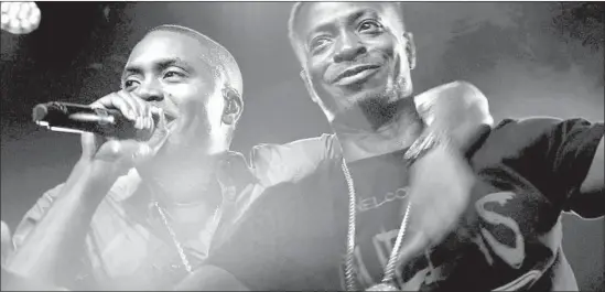  ?? Netf lix ?? RAPPER NAS, left, and his brother Jungle appear onstage in a scene from the Netf lix docuseries “Rapture,” which shines a spotlight on some of hip-hop’s top talent.