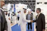  ??  ?? Butti Saeed Al Ghandi tours Paperworld Middle East 2019. Right, visitor explores products at one of the participat­ing pavilions.