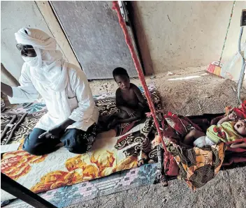  ?? Picture: REUTERS / ZOHRA BENSEMRA ?? CHANGE OF PLAN: Andre Chani, 44, a former migrant smuggler, lives with his children at his house on the outskirts of Agadez, Niger.