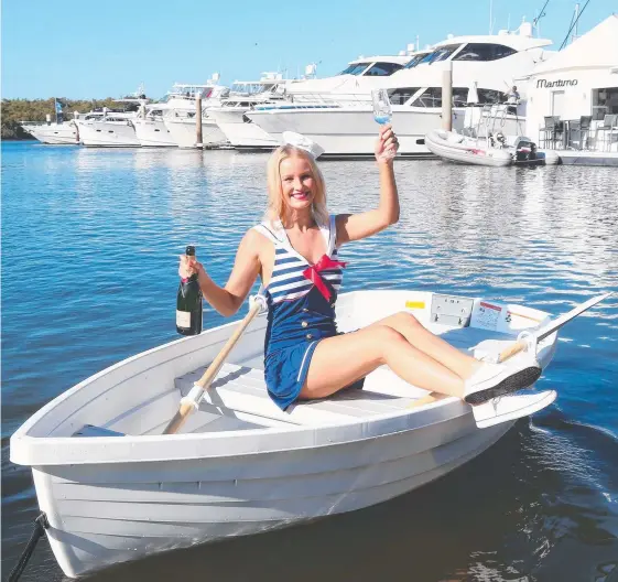  ?? Picture: MIKE BATTERHAM ?? Jacqueline BoJanowski, 23, pictured in a Walker Bay Row Boat at the Sanctuary Cove Boat show.