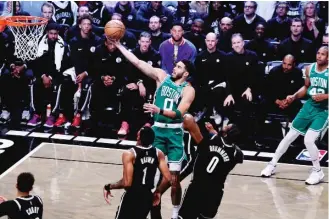  ?? AL BELLO/GETTY IMAGES ?? Jayson Tatum scored 39 points in the Celtics’ Game 3 victory Saturday over the Nets.
