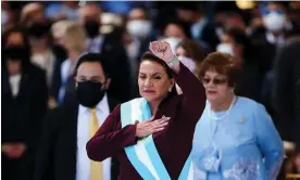  ?? Photograph: José Cabezas/Reuters ?? Honduras new president Xiomara Castro raises her fist as she sings the national anthem during her swearing-in ceremony in January.