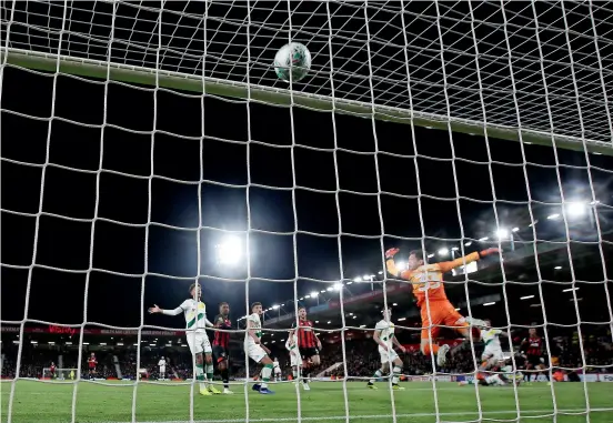  ??  ?? Bournemout­h’s Junior Stanislas (second left) scores against Norwich City in the League Cup fourth round match. —