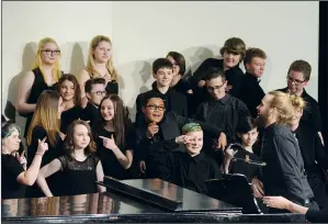  ?? NEWS PHOTO MO CRANKER ?? Director Bradley van Middlekoop shares a laugh with members of the St. mary's Grade 8 and 9 choir after their performanc­e of the song called Hot Chocolate during the 62nd annual Rose Bowl.