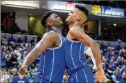  ?? ANDY LYONS /GETTY IMAGES ?? Duke’s Zion Williamson (left) and Javin DeLaurier celebrate Tuesday night’s 118-84 victory over Kentucky in Indianapol­is.