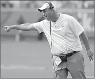  ?? AP/CHUCK BURTON ?? Tennessee Coach Jeremy Pruitt directs his team against West Virginia on Saturday in Charlotte, N.C.