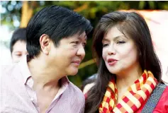  ?? — Reuters photo ?? Ferdinand Marcos Jr talks to sister Imee during a political rally in Manila.