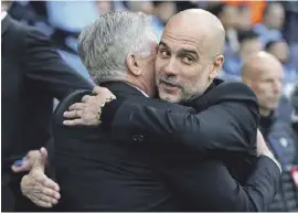  ?? Foto: dpa ?? Pep Guardiola (r), und Carlo Ancelotti, Trainer von Real.