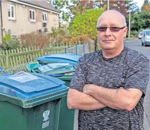  ?? ?? Discontent Thomas McLean of Logie Crescent with his blue bins