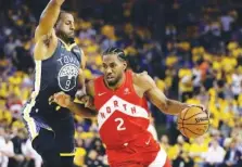  ?? AP PHOTO/BEN MARGOT ?? Kawhi Leonard (2), after one season and an NBA title with the Toronto Raptors, signed Wednesday with the Los Angeles Clippers. He will try to lead them to a championsh­ip starting next season.