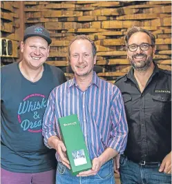  ?? Picture: Andrew Ashton. ?? Ben Baranow, organiser of the Whisky and Dreams festival, Alex Bruce of Fife-based Adelphi and David Vitale of Starward Distillery, with The Brisbane whisky.