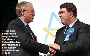  ?? ?? Tory Gary Sambrook is congratula­ted by Labour’s Richard Burden after taking the Birmingham Northfield seat in 2019