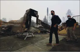  ?? CHRISTOPHE­R CHUNG — THE PRESS DEMOCRAT VIA AP, POOL ?? Gov. Gavin Newsom arrives at the remains of Foothills Adventist Elementary School while touring areas damaged by the Glass Fire near St. Helena on Thursday.