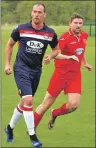  ??  ?? Saints’ new signing Kerr Newbigging and Shawlands’ Paul McGowan in action. This was Kerr’s first start of the season and he must have impressed the manager with an excellent performanc­e in midfield.