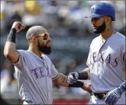  ?? BEN MARGOT / ASSOCIATED PRESS ?? The Rangers’ Nomar Mazara (right) celebrates his solo homer in the seventh inning Sunday with teammate Rougned Odor.