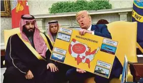  ?? EPA PIC ?? President Donald Trump (right) holding up a chart of military hardware sales at a meeting with Saudi Arabia’s Crown Prince Mohammed bin Salman at the White House in Washington, DC, on Tuesday.
