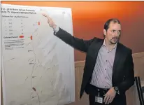  ?? ANDREW ROBINSON/THE COMPASS ?? Transporta­tion and Works assistant deputy minister Joe Dunford draws attention to a map highlighti­ng collision locations on Veteran’s Memorial Highway from 2012-2016.