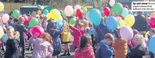  ??  ?? Up and away Burnside pupils release their balloons into the sky