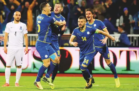  ?? Reuters ?? Arber Zeneli celebrates after scoring Kosovo’s first goal against Azerbaijan in the Uefa Nations League in Pristina on Tuesday. The small Balkan republic routed Azerbaijan 4-0 to cap an impressive campaign in the inaugural Uefa Nations League.