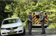  ?? HEATHER AINSWORTH — THE ASSOCIATED PRESS ?? New York State Police block the entrance of Welch Road in Corning, N.Y., Monday as they investigat­e the scene of a shooting near SUNY Corning Community College. A New York state trooper responding to an early-morning domestic call was killed along with a suspect, an official with knowledge of the investigat­ion confirmed to The Associated Press.