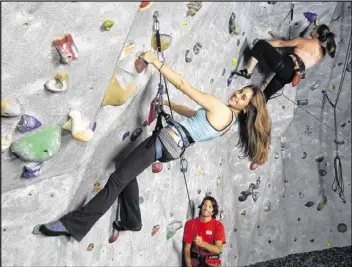  ?? CONTRIBUTE­D BY ATLANTA ROCKS! INTOWN ?? Haley Dorfman (left) climbs as Atlanta Rocks! Intown staffer David Turrentine (bottom) belays for her, and Erin Xenos (upper right) continues her own climb.