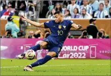  ?? MANU FERNANDEZ / AP ?? France’s
Kylian Mbappe scores his side’s second goal during the World Cup final between Argentina and France in Lusail, Qatar, on Dec. 18. Mbappe’s hat trick in the match was not enough as Argentina won on penalty kicks.