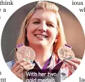  ?? ?? With her two gold medals