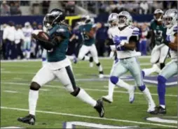  ?? MICHAEL AINSWORTH — THE ASSOCIATED PRESS ?? Eagles running back Jay Ajayi (36) leads Dallas’ Xavier Woods (25) and Byron Jones (31) on a long run earlier this season in Arlington, Texas. Ajayi could be busy when the Eagles open the playoffs at home next weekend.