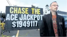  ?? PAUL DALY/CANADIAN PRESS ?? Terry O’Halligan who drove in from Grand Falls, 400 kms away, stands in line to purchase tickets for the final draw of Chase the Ace in Goulds, Newfoundla­nd on Wednesday.