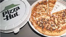  ?? EMILY HEIL/WASHINGTON POST ?? Pizza Hut is trying out a sustainabl­e, compostabl­e round design for its pizza boxes.