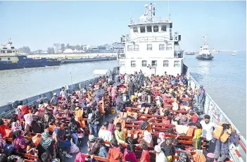  ?? — AFP photo ?? Rohingya refugees are seen on a Bangladesh’s Navy ship as they are being relocated to Bhashan Char Island in the Bay of Bengal, in Chittagong.