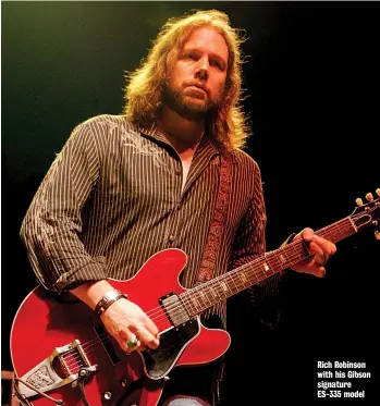  ??  ?? Rich Robinson with his Gibson signature ES-335 model