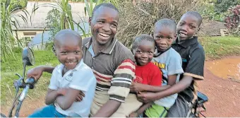  ?? THOMAS FROESE ?? Paul Mukhwana with his children — from left, Edith, 8, Philip, 6, Steven, 10, and Alex, 15 — during happier times. Now in the pandemic, Ugandans are among the majority of the world’s people facing disparitie­s greater than most Canadians can imagine, writes Thomas Froese.