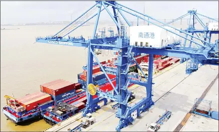  ??  ?? In this July 18, 2019 photo, shipping containers are loaded onto a cargo ship at a port in Nantong in eastern China’s Jiangsu province. President Donald Trump intensifie­d pressure on China to reach a trade deal by saying he will impose 10% tariffs Sept 1 on the remaining $300 billion in Chinese imports
he hasn’t already taxed. (AP)