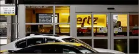  ?? Joe Raedle / Getty Images ?? Hertz is also in discussion­s with other automakers about buying additional electric vehicles as it expands its EV fleet.