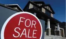  ?? SEAN KILPATRICK/THE CANADIAN PRESS FILE PHOTO ?? Sales of homes worth $1 million or more heated up in Toronto and Vancouver last year, according to a real estate report.