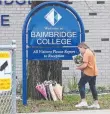  ?? ?? Flowers are left at Baimbridge College in Hamilton. Picture: David Crosling