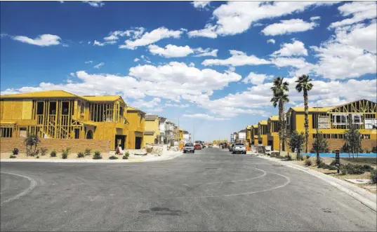  ?? Patrick Connolly Las Vegas Review-Journal @PConnPie ?? Frames of new Century Communitie­s homes in southwest Las Vegas. Contractor­s are “constantly short” on laborers, lengthenin­g the time it takes to deliver a house, said Robb Beville, Nevada division president for Century Communitie­s.