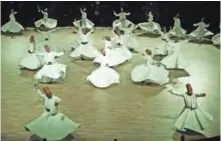  ??  ?? Whirling dervishes perform a “Sema” ritual during a ceremony.