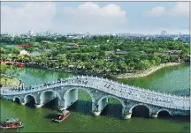  ?? PROVIDED TO CHINA DAILY ?? The Millennium City Park in Kaifeng is a life-size reimaginin­g of the painting Along the River During the Qingming Festival.