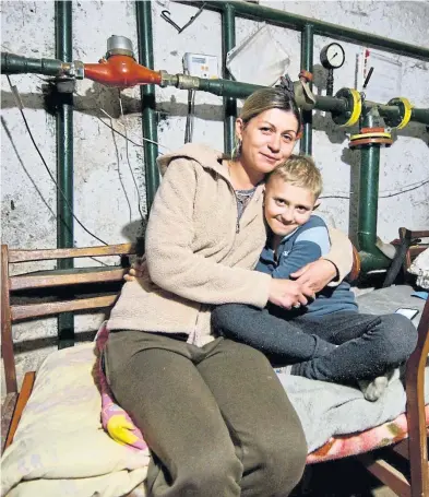  ?? Jen Stout ?? Yulia and her son Misha, eight, in their makeshift home in the basement of an apartment building in Kharkiv, Ukraine
Picture