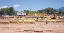  ?? ADOLPHE PIERRE-LOUIS/JOURNAL ?? Pavilion Constructi­on crews are building an affordable apartment complex near Montgomery Boulevard NE and Interstate 25.