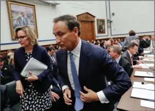  ?? The Associated Press ?? EPIC PROPORTION­S: United Airlines CEO Oscar Munoz gets up from his seat during a break from testifying Tuesday on Capitol Hill in Washington before a House Transporta­tion Committee oversight hearing.