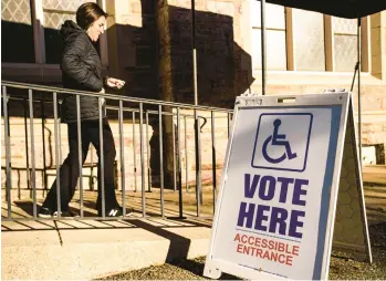  ?? APRIL GAMIZ/THE MORNING CALL ?? A voter leaves Rivers of Life Seibert Church in Allentown just before 9 a.m. Tuesday.