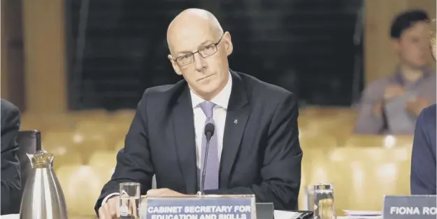  ?? PICTURE; ANDREW COWAN ?? 0 John Swinney told Holyrood’s education committee yesterday he is very sensitive to the argument about primary one assessment