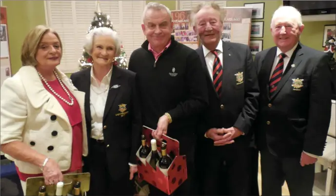  ??  ?? Vivienne Sullivan and Jack Gogarty, winners on the front nine holes in the Presidents’ Mixed Competitio­n at County Louth Golf Club, are congratula­ted by Lady President Felicity Matthews, Club President Michael McGuigan and Club Captain Harry Collier.