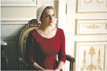  ?? GEORGE KRAYCHYK/HULU ?? Elisabeth Moss is nominated for an Emmy Award for Lead Actress in a Drama Series for her role as Offred in “The Handmaid’s Tale.” The program is also nominated in the Outstandin­g Drama Series category.